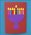 חתכו 9 חתיכות נייר בצבע כתום או צהוב והדביקו אותם מעל לנרות החנוכיה.
זהו, אתם יכולים לקשט את הכרטיס חנוכה שלכם ולרשום ברכה יפה לחג.
חג חנוכה שמח!